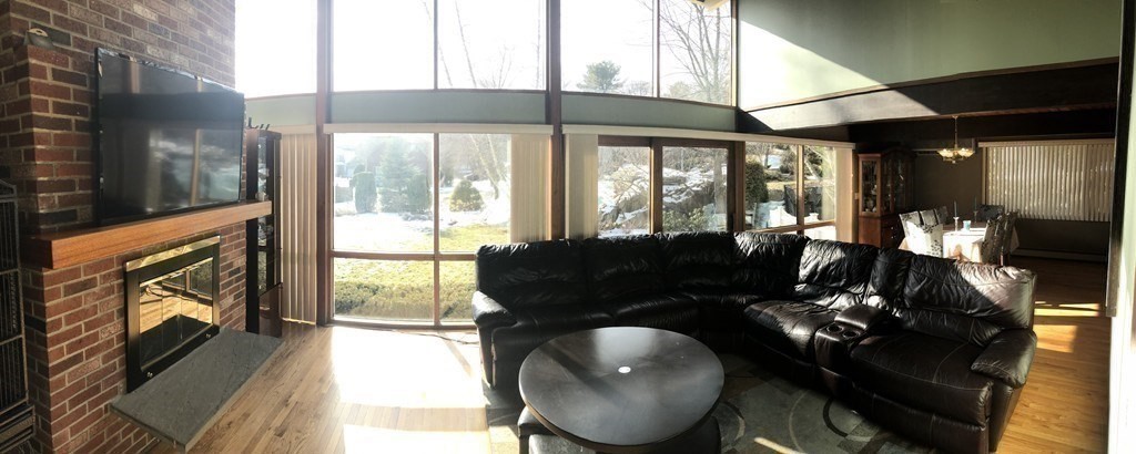 5 Clipper Way Beverly, MA 01915 - Photo 25 of 42 a living room with furniture and a floor to ceiling window