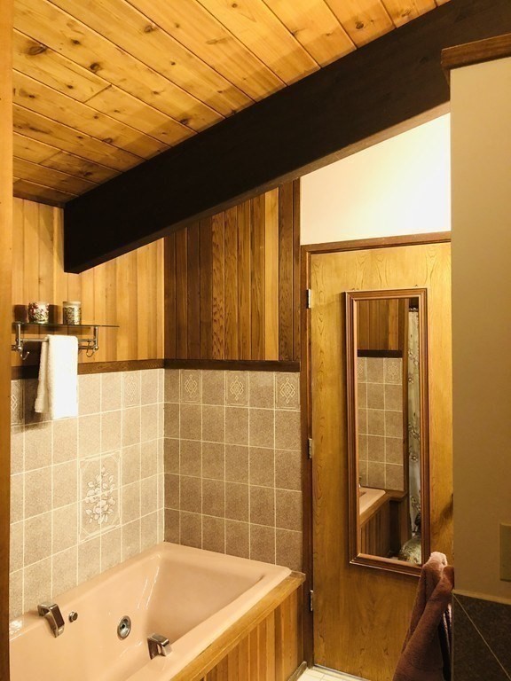 5 Clipper Way Beverly, MA 01915 - Photo 29 of 42 a bathroom with a bathtub and shower
