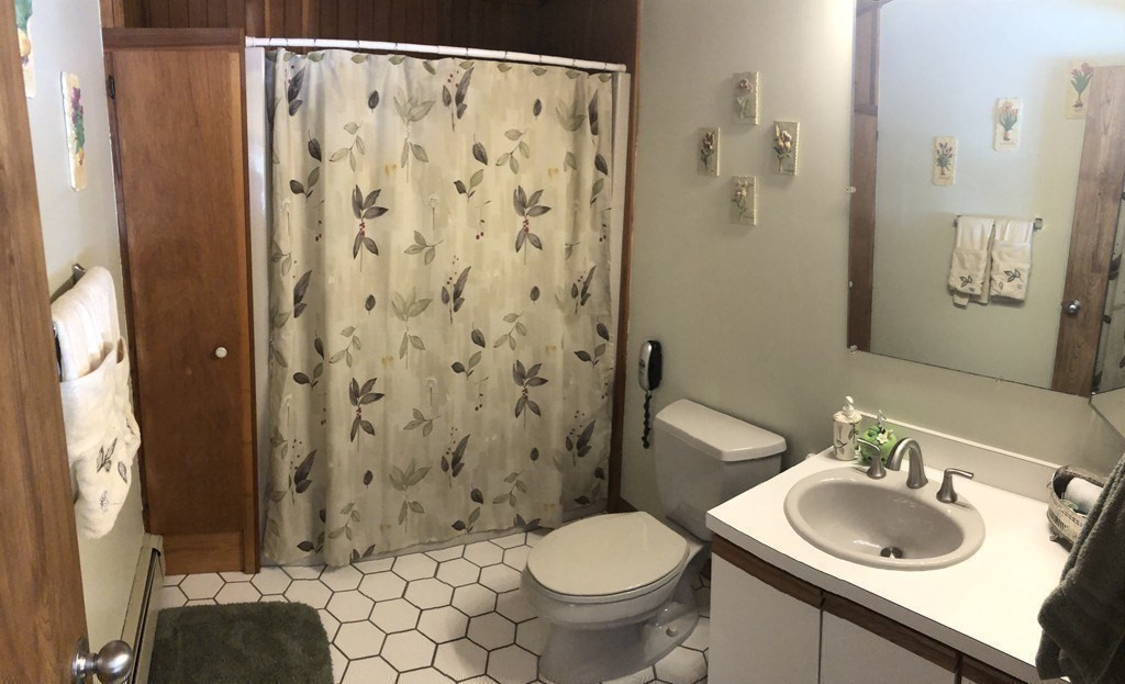 5 Clipper Way Beverly, MA 01915 - Photo 35 of 42 a bathroom with a sink toilet and shower