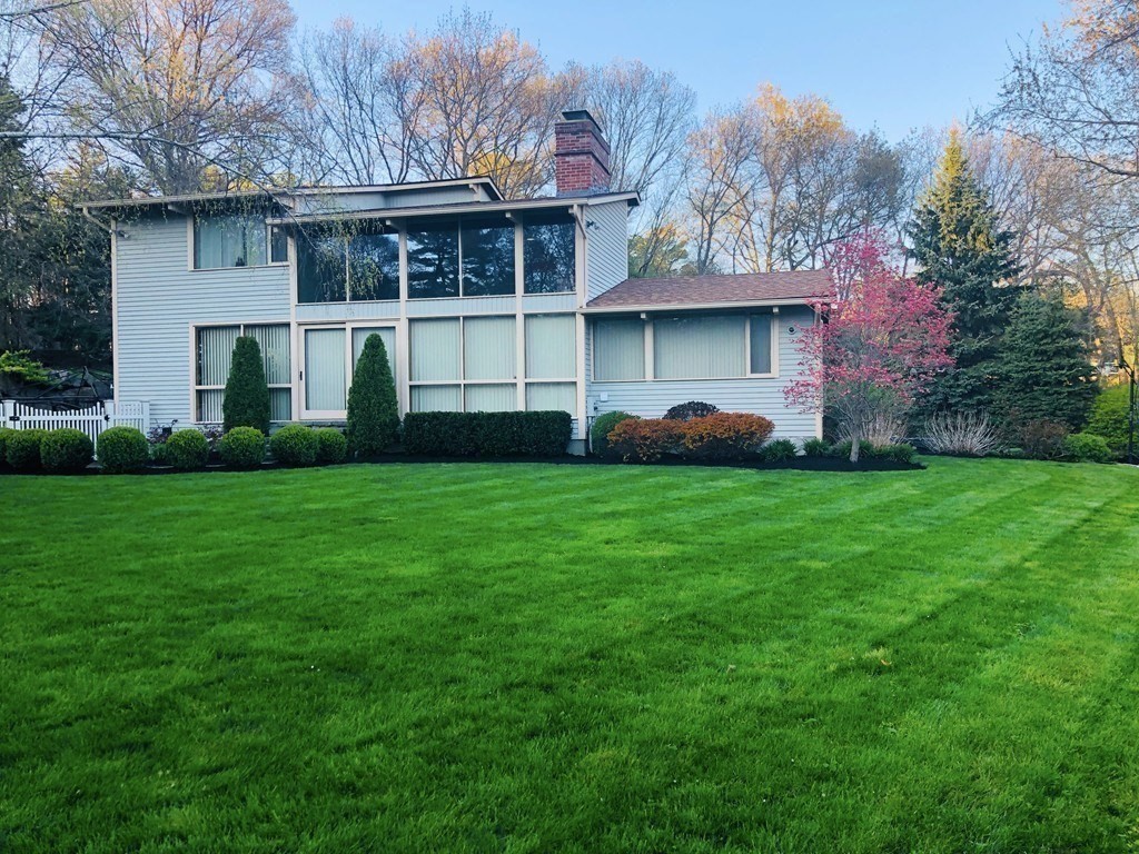 5 Clipper Way Beverly, MA 01915 - Photo 42 of 42 a front view of a house with a garden and plants