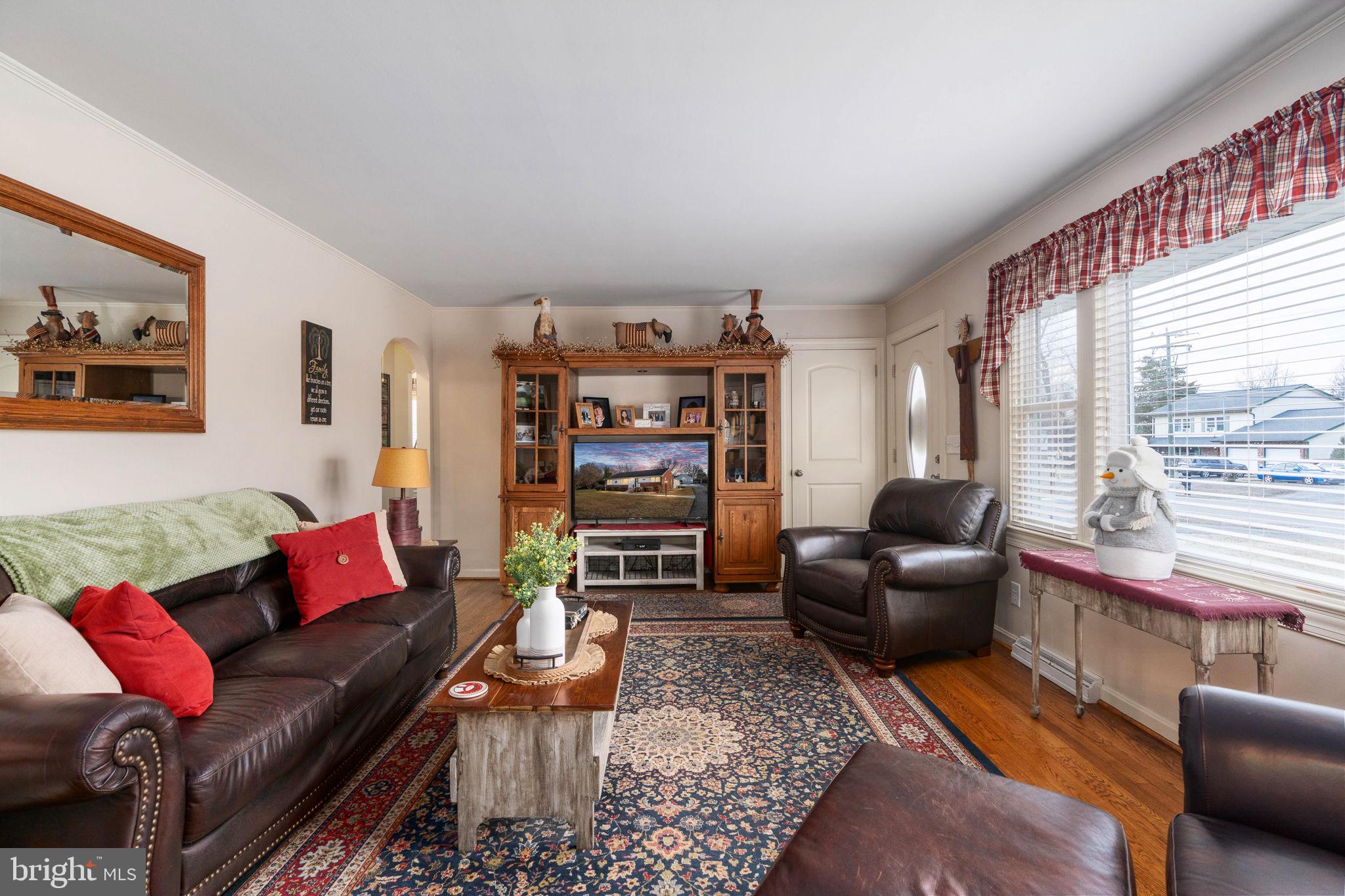 511 Ferry Road Fredericksburg, VA 22405 - Photo 11 of 55 a living room with furniture a rug and a large window