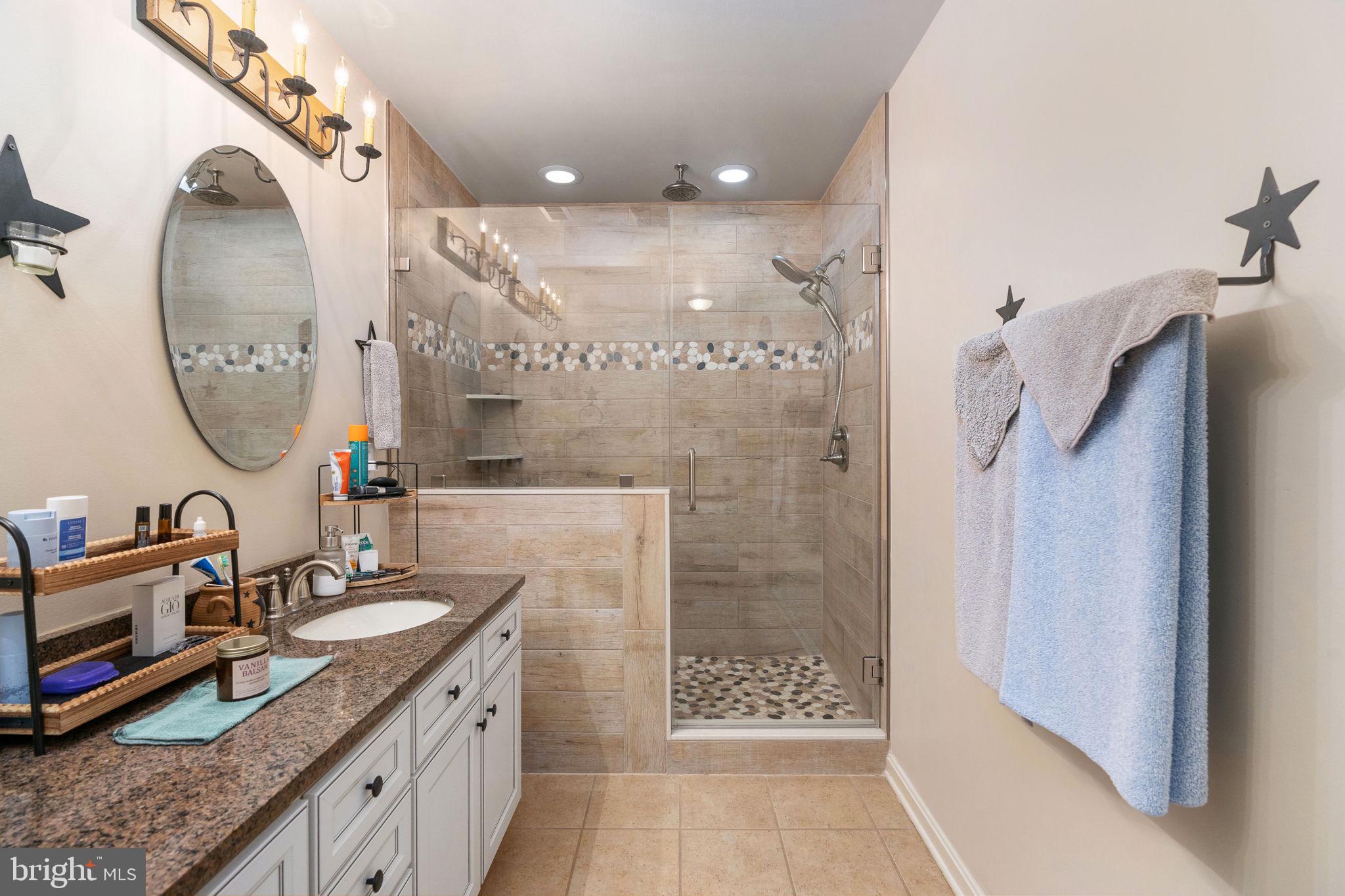 511 Ferry Road Fredericksburg, VA 22405 - Photo 28 of 55 a bathroom with a sink double vanity and a mirror