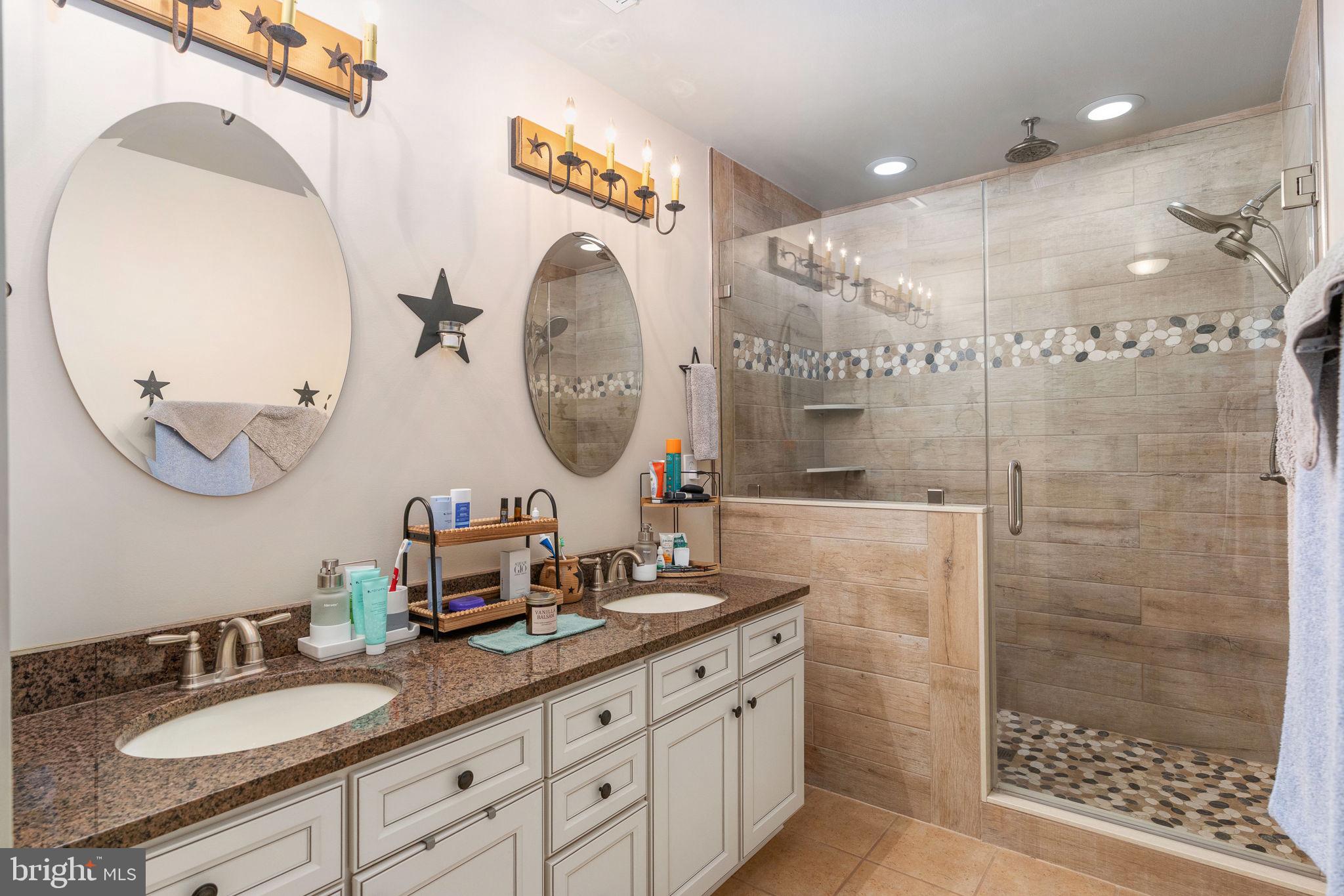 511 Ferry Road Fredericksburg, VA 22405 - Photo 29 of 55 a bathroom with a double vanity sink mirror and shower