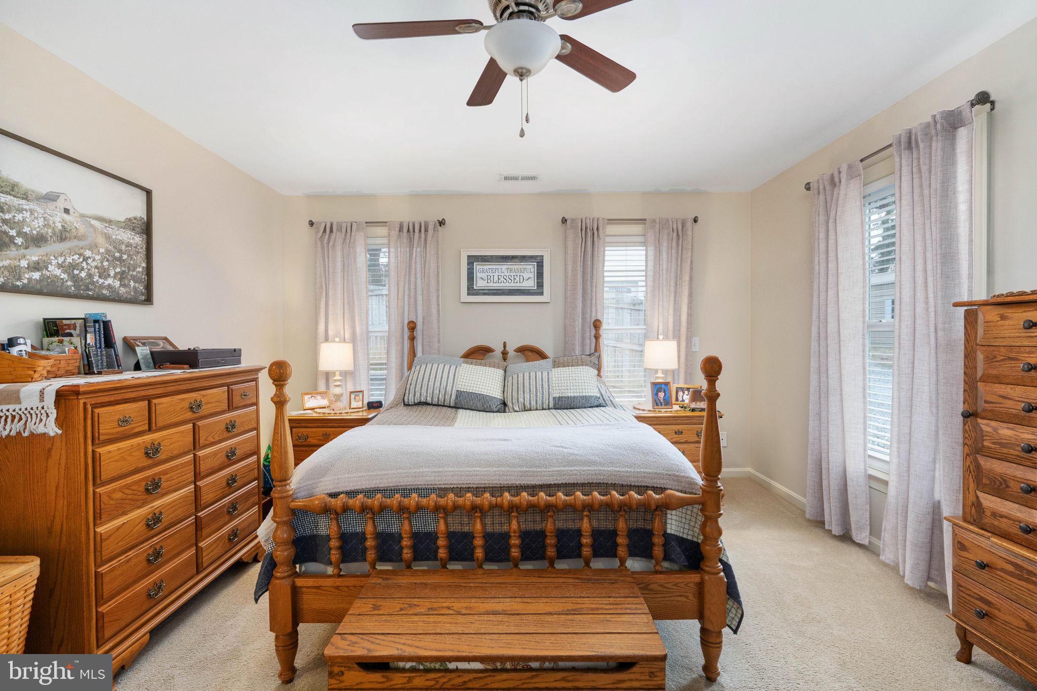 511 Ferry Road Fredericksburg, VA 22405 - Photo 31 of 55 a bedroom with a bed and a chandelier