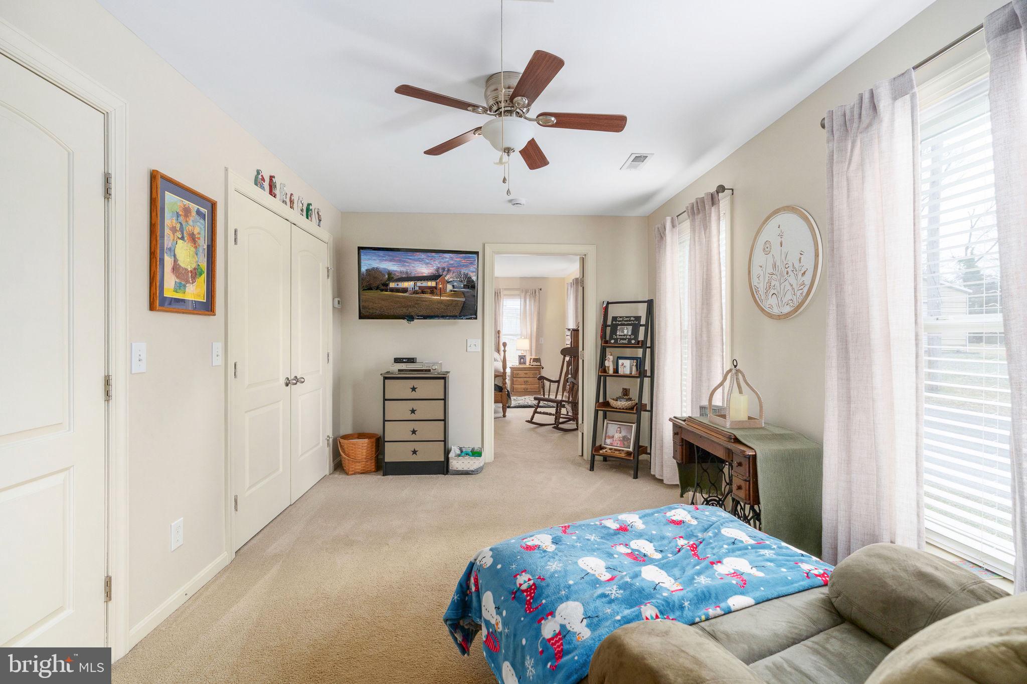 511 Ferry Road Fredericksburg, VA 22405 - Photo 34 of 55 a bedroom with furniture and a chandelier