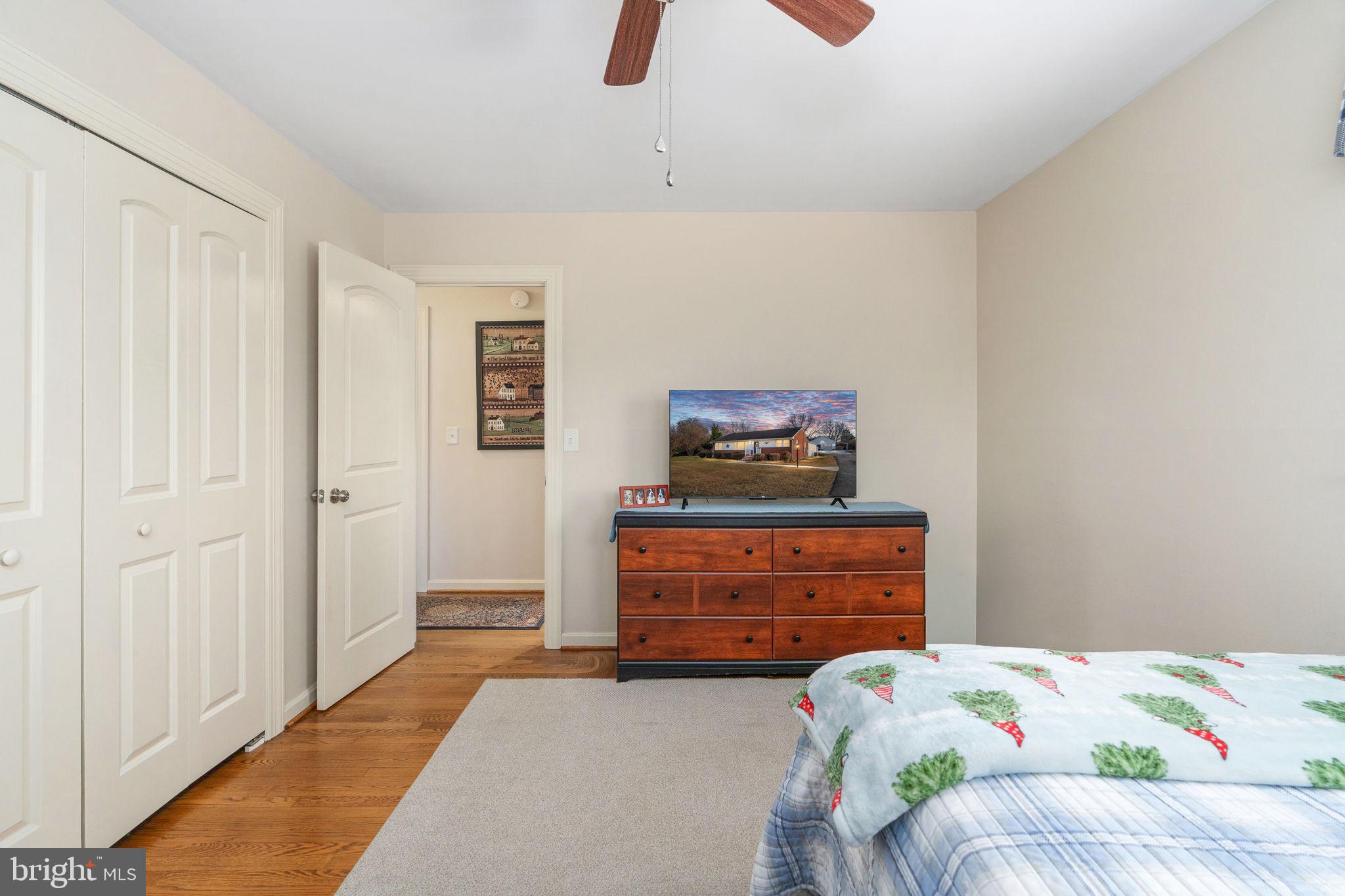 511 Ferry Road Fredericksburg, VA 22405 - Photo 37 of 55 a bedroom with a bed and a dresser