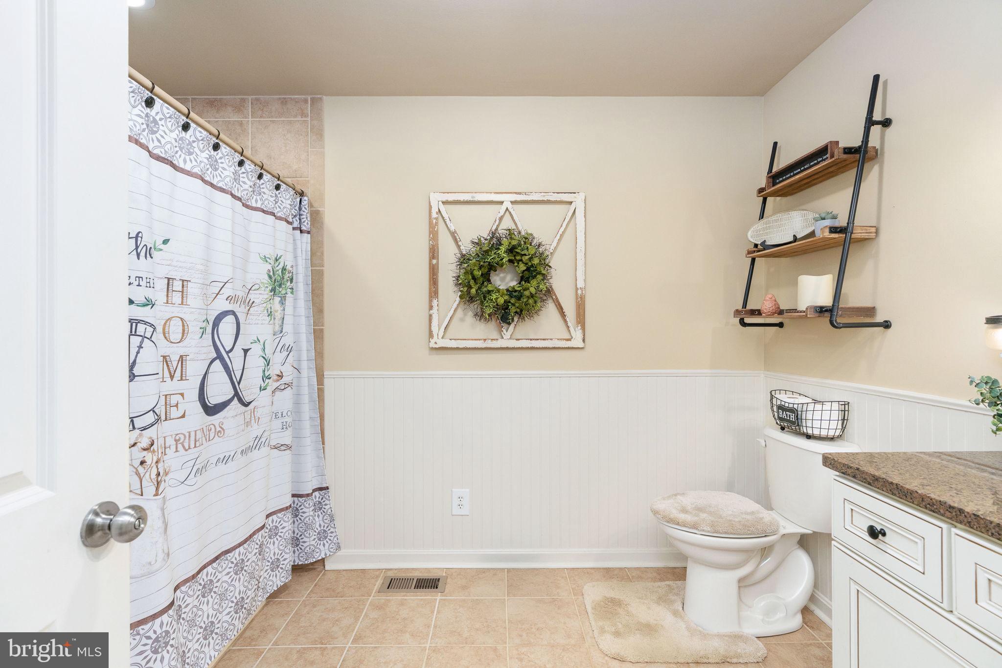 511 Ferry Road Fredericksburg, VA 22405 - Photo 40 of 55 a white toilet sitting next to a bathroom sink