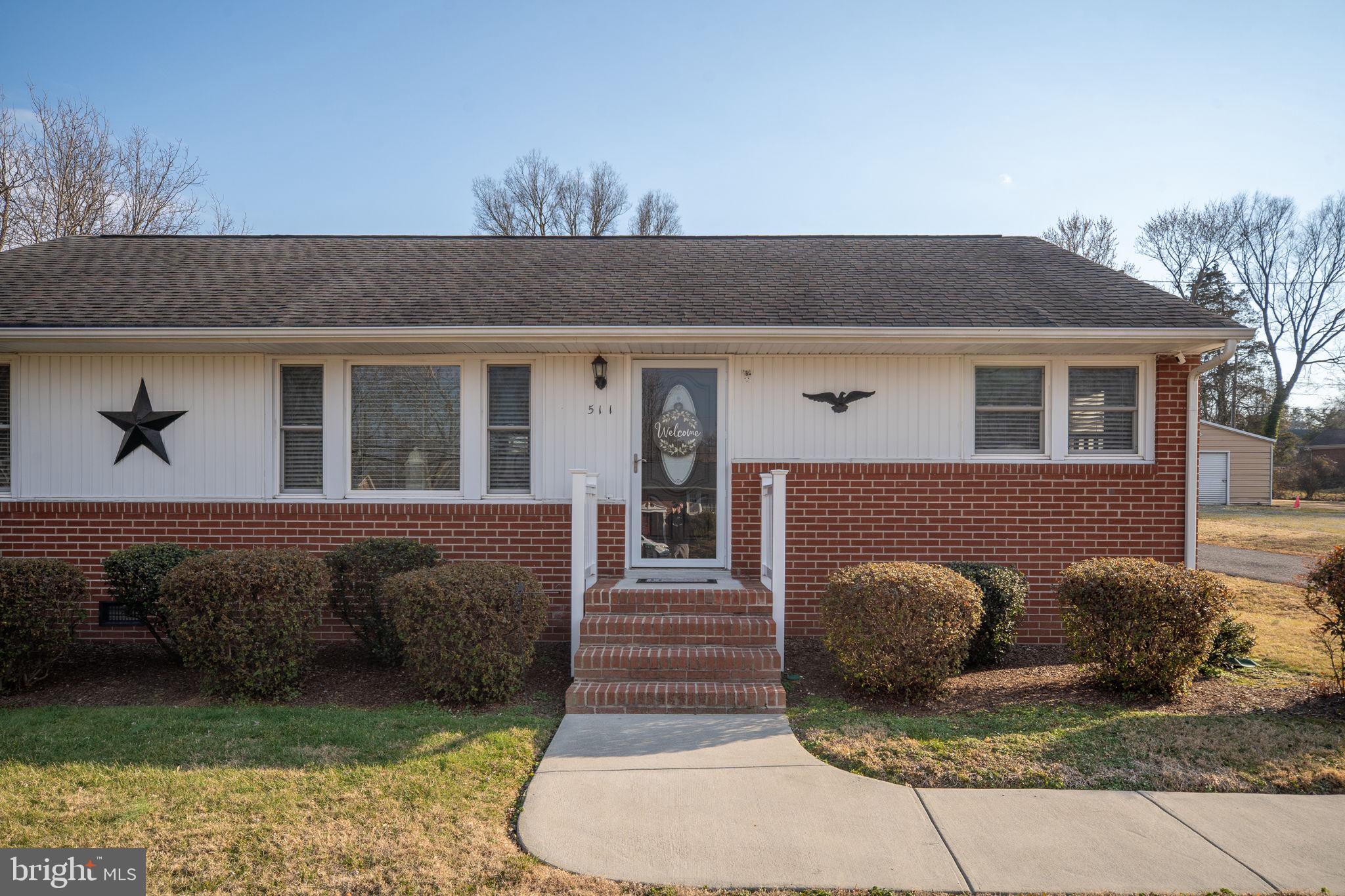 511 Ferry Road Fredericksburg, VA 22405 - Photo 4 of 55 a front view of a house with garden