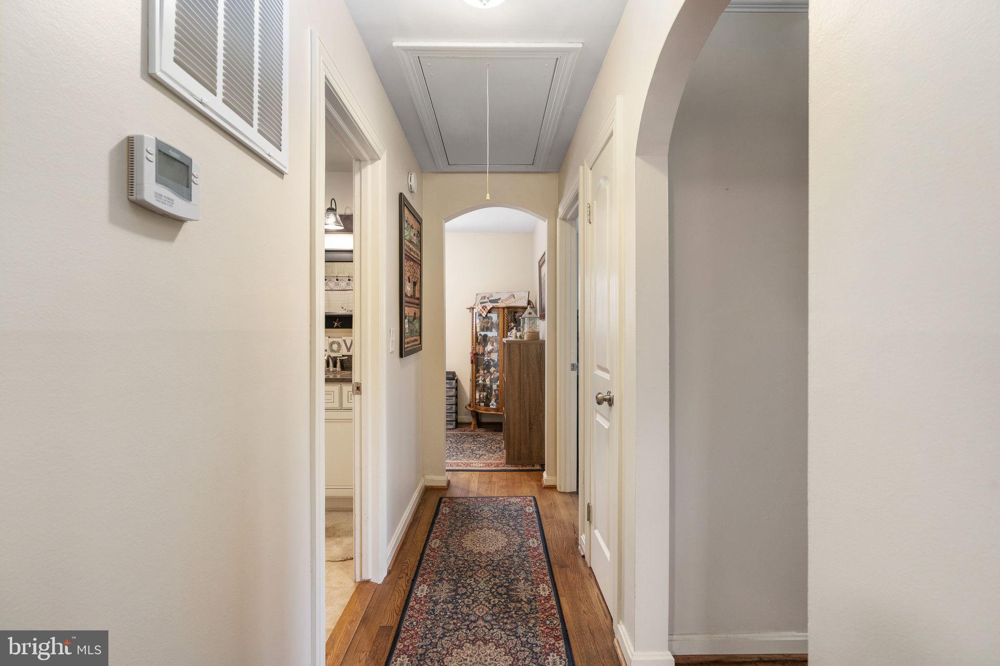 511 Ferry Road Fredericksburg, VA 22405 - Photo 42 of 55 a view of a hallway with wooden floor and staircase