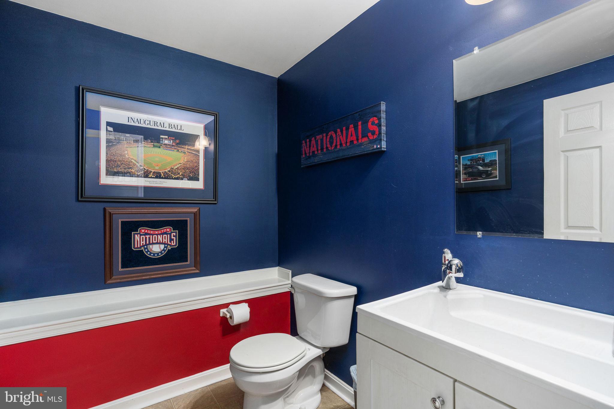 511 Ferry Road Fredericksburg, VA 22405 - Photo 43 of 55 a bathroom with a toilet a sink and a mirror