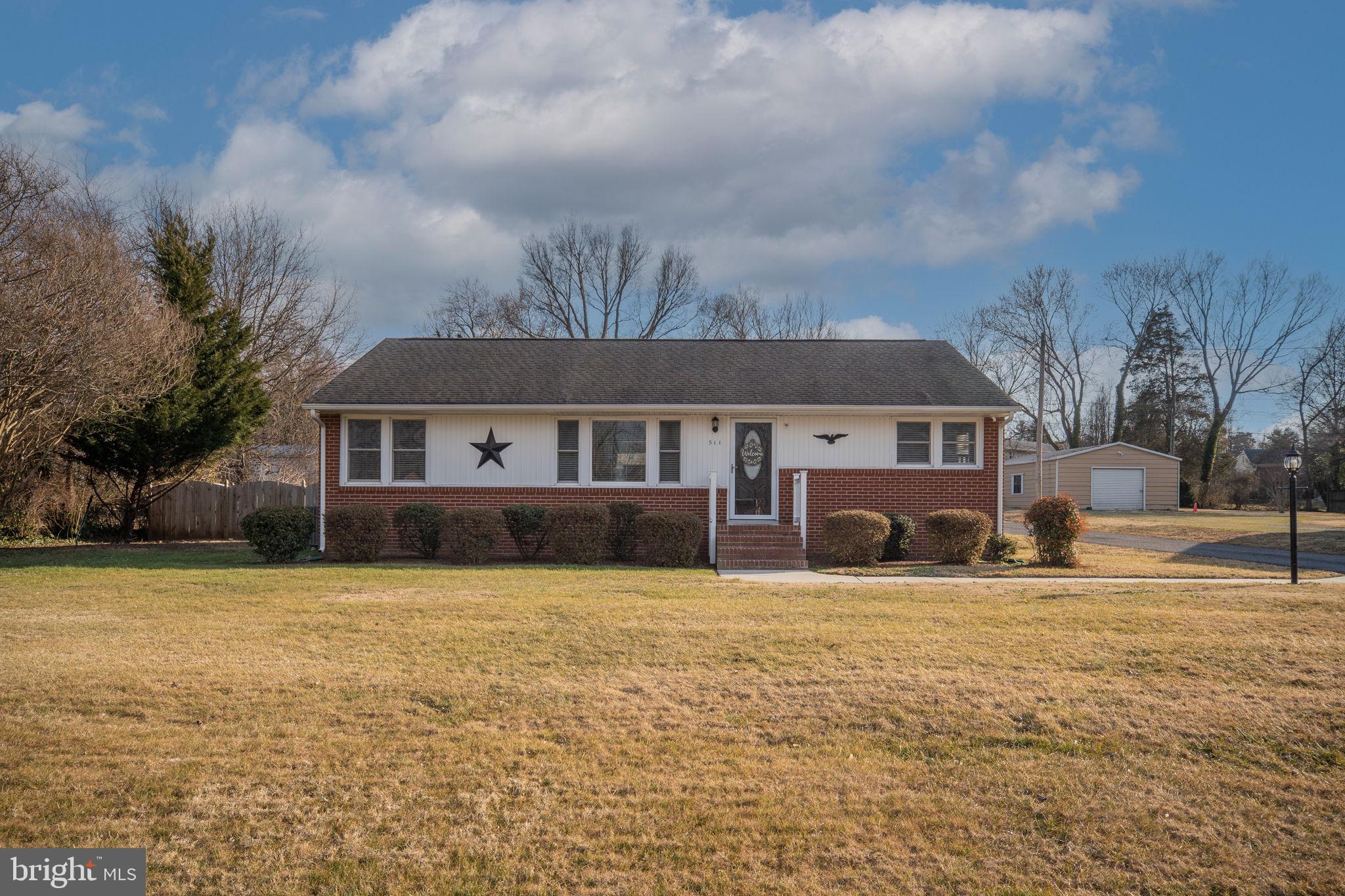 511 Ferry Road Fredericksburg, VA 22405 - Photo 6 of 55 a front view of a house with a yard