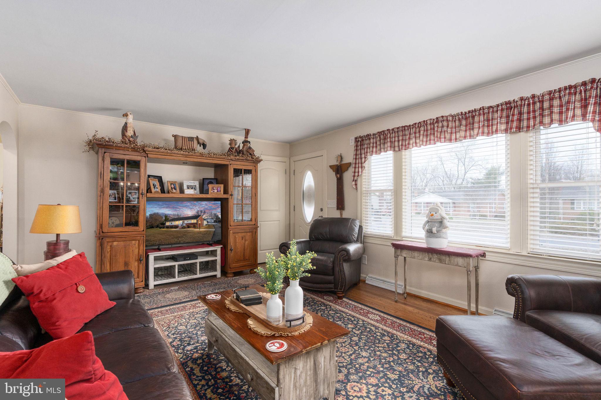 511 Ferry Road Fredericksburg, VA 22405 - Photo 10 of 55 a living room with furniture a rug and a large window