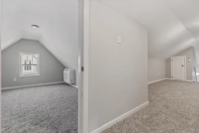 a view of a big room with windows