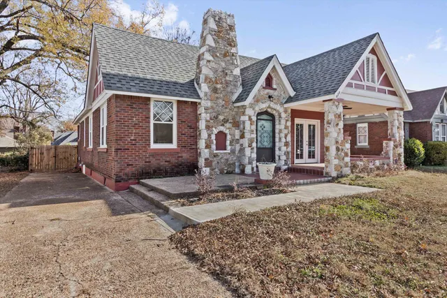 a front view of a house with garden