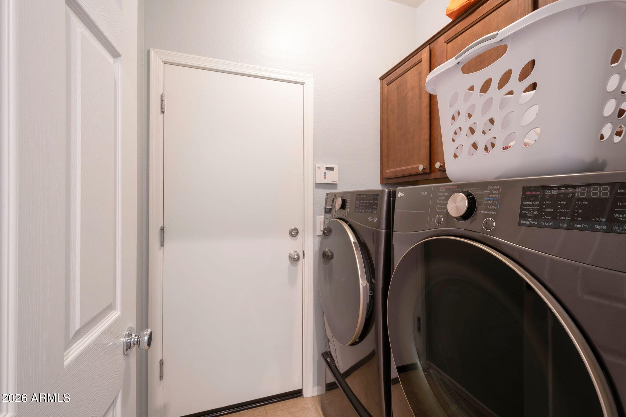 225 West Reeves Avenue Queen Creek, AZ 85140 - Photo 13 of 25 a utility room with dryer and washer
