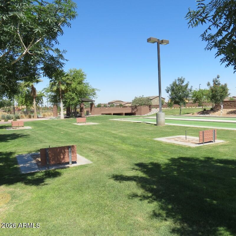 225 West Reeves Avenue Queen Creek, AZ 85140 - Photo 19 of 25 a backyard of a house with table and chairs