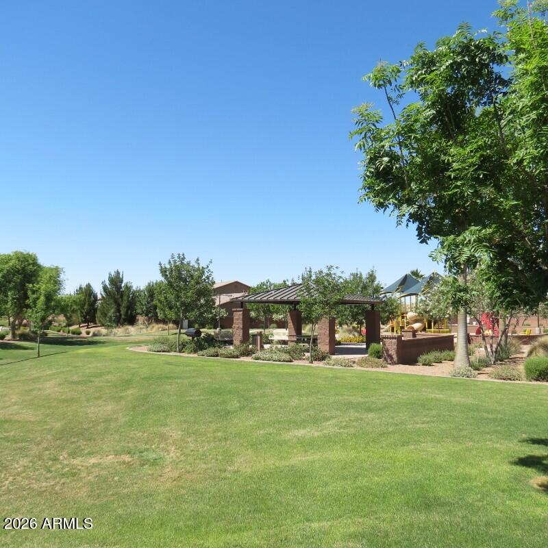 225 West Reeves Avenue Queen Creek, AZ 85140 - Photo 22 of 25 a view of a green field with houses in the background