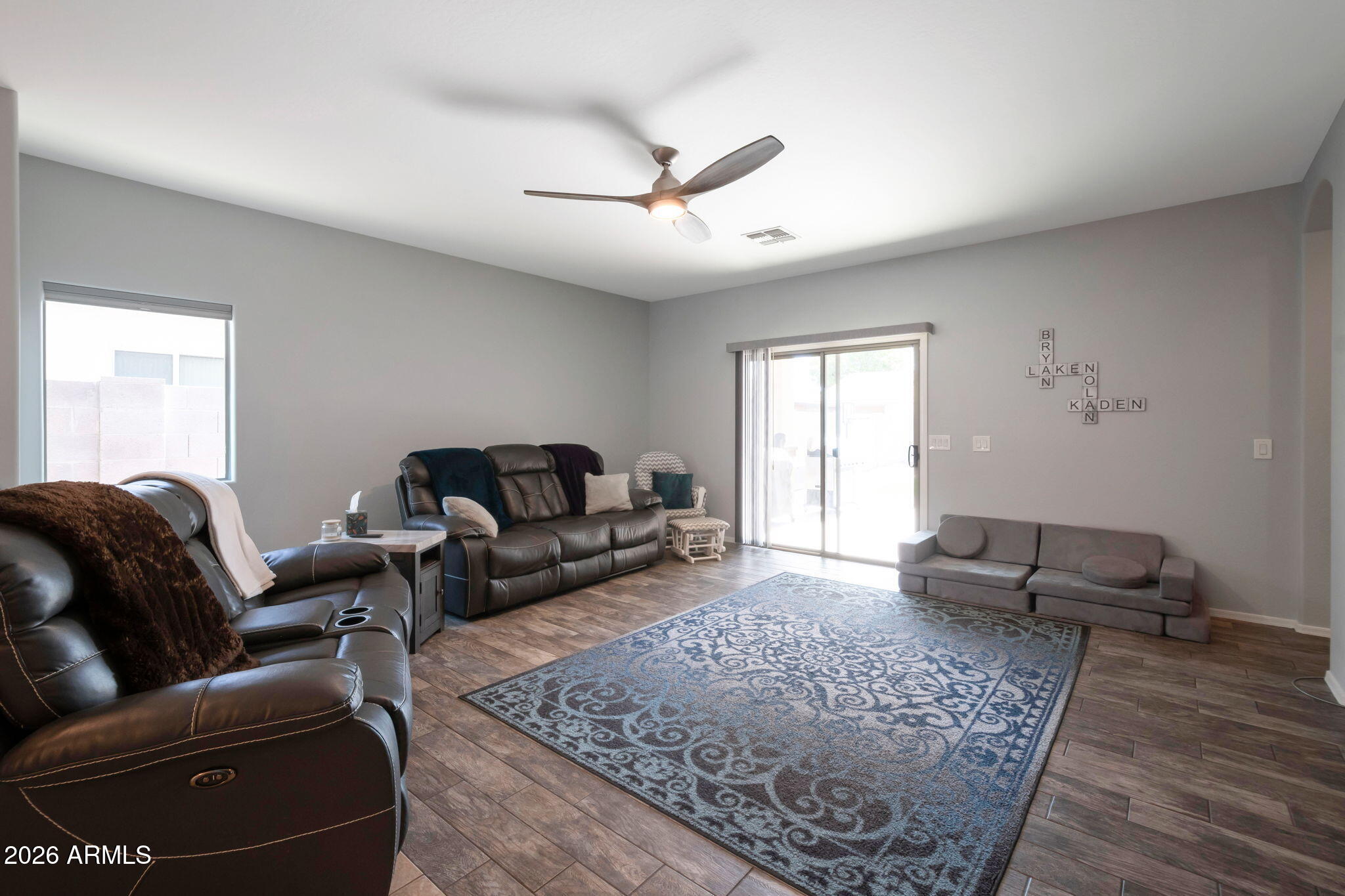 225 West Reeves Avenue Queen Creek, AZ 85140 - Photo 5 of 25 a living room with furniture and a rug