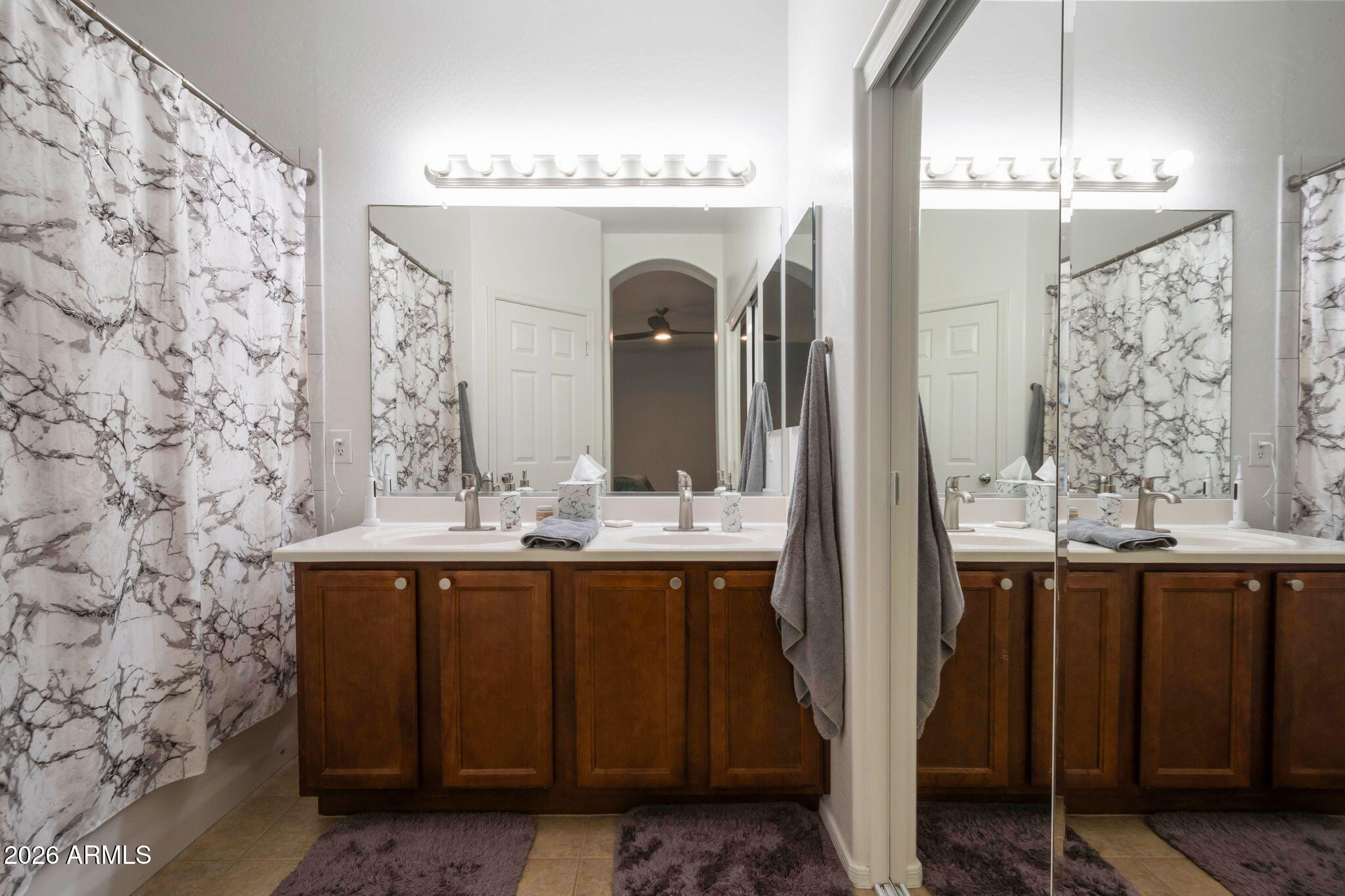 225 West Reeves Avenue Queen Creek, AZ 85140 - Photo 7 of 25 a bathroom with a sink and a mirror