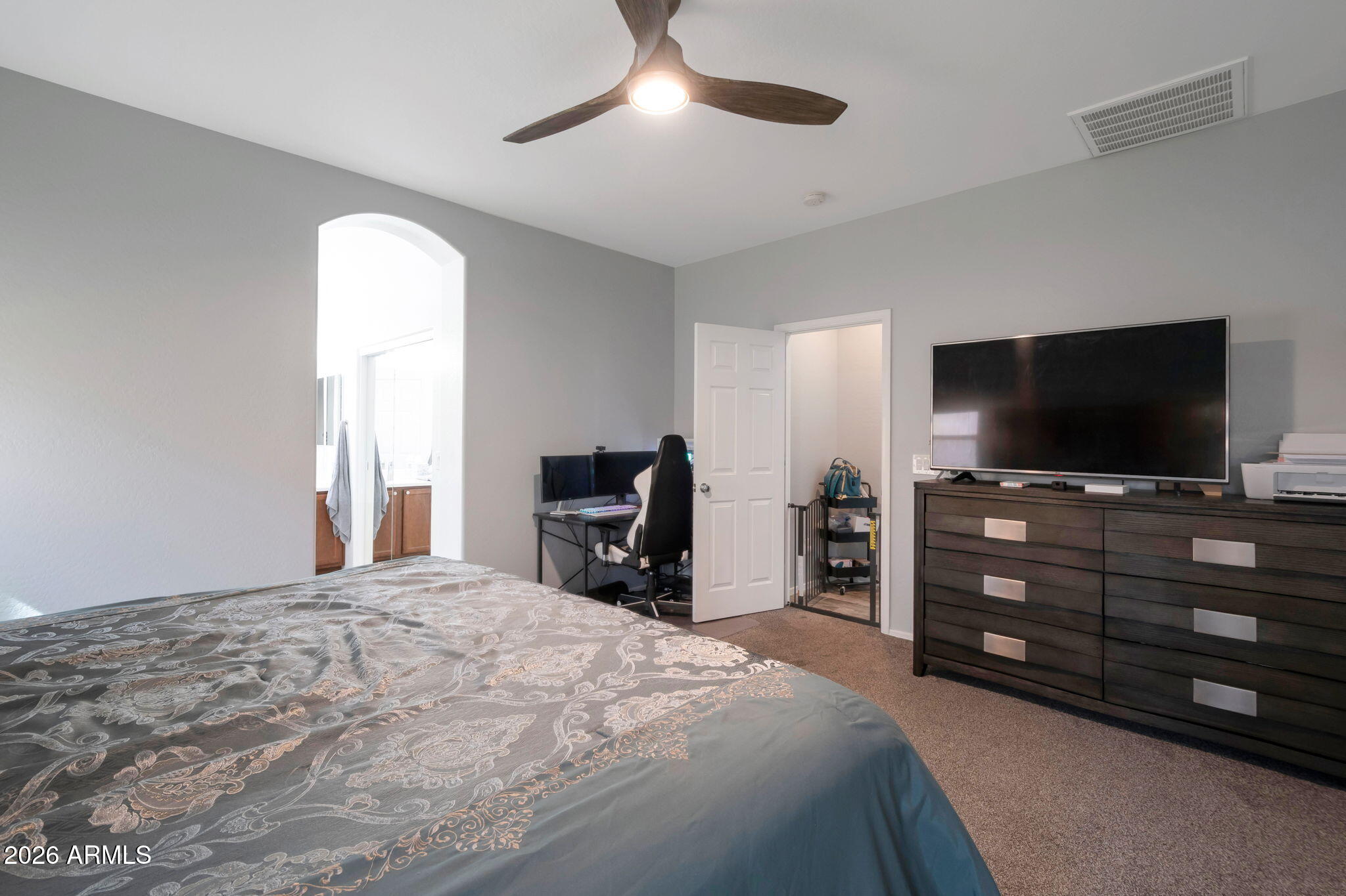 225 West Reeves Avenue Queen Creek, AZ 85140 - Photo 9 of 25 a bedroom with a bed and a flat screen tv