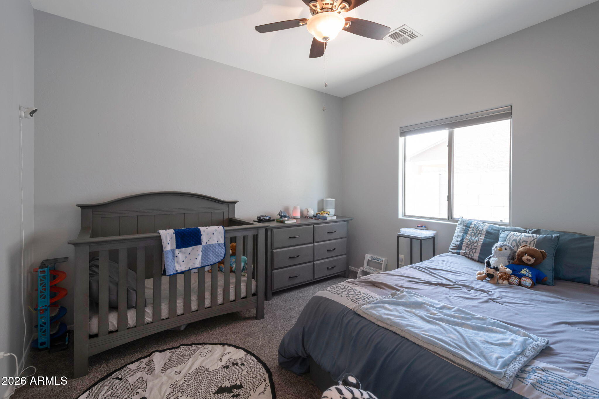 225 West Reeves Avenue Queen Creek, AZ 85140 - Photo 10 of 25 a bedroom with a bed and a chandelier