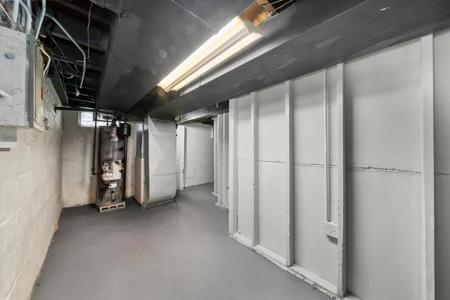 a view of empty room with wooden walls