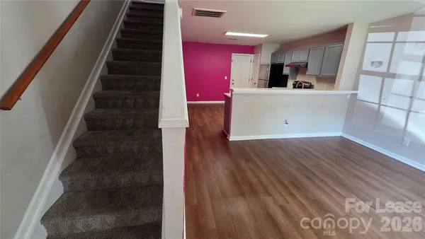 a kitchen with granite countertop a stove and a refrigerator