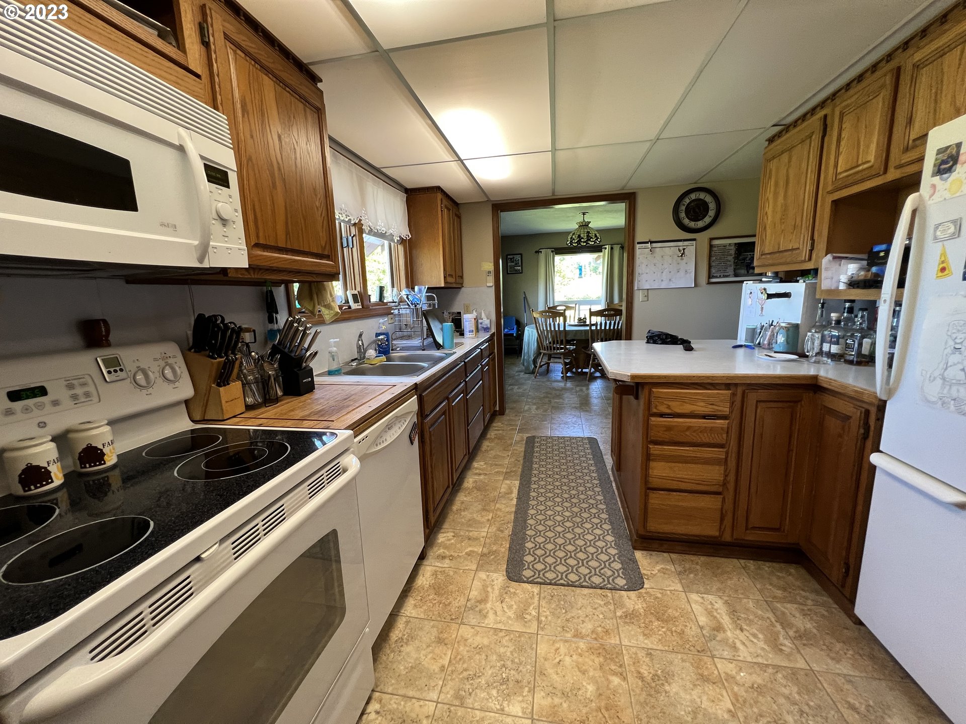 39489 Kingston Jordan Road Scio, OR 97374 - Photo 33 of 47 a kitchen with stainless steel appliances kitchen island granite countertop a sink and cabinets
