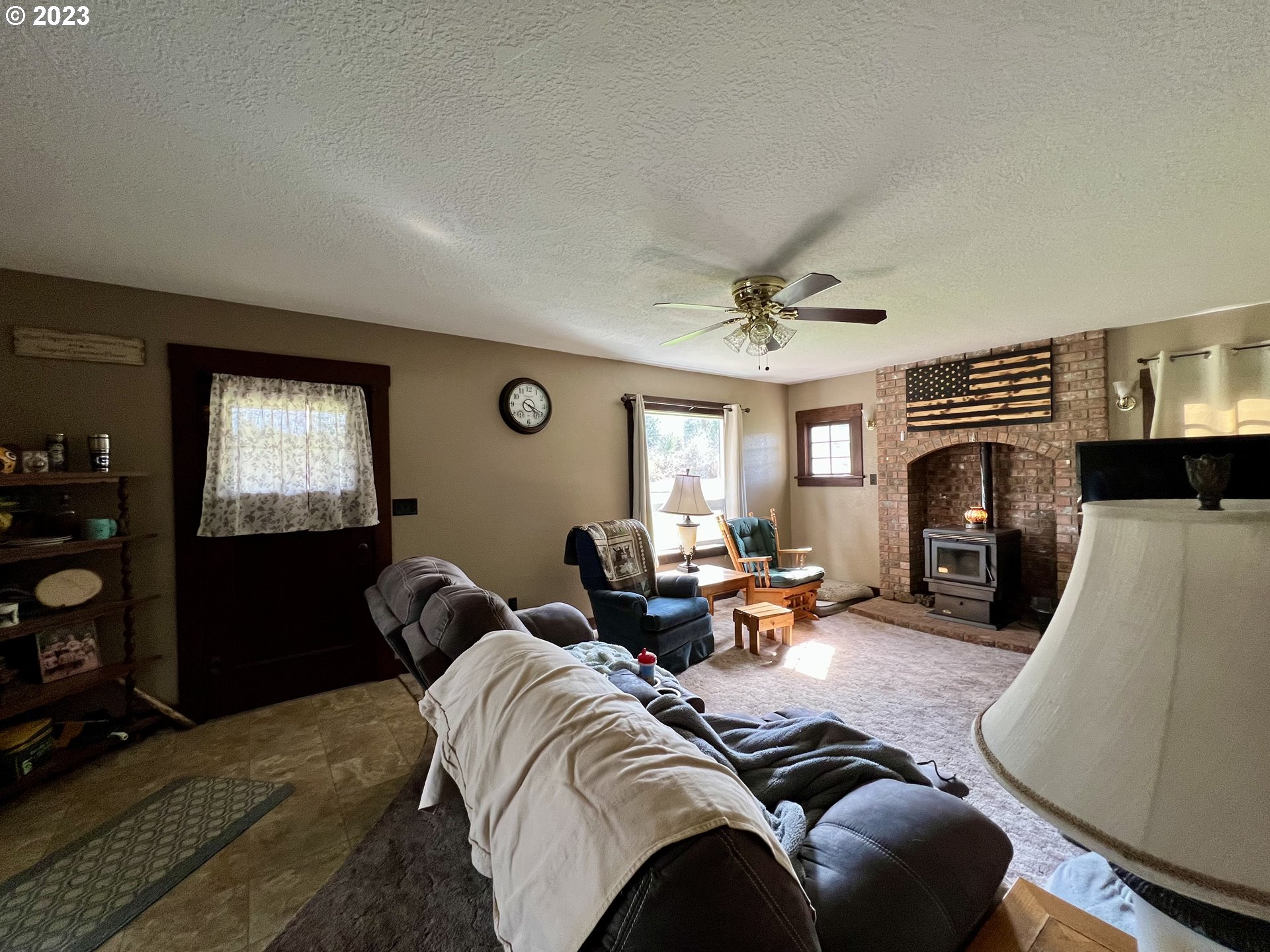 39489 Kingston Jordan Road Scio, OR 97374 - Photo 36 of 47 a living room with furniture a fireplace and a flat screen tv