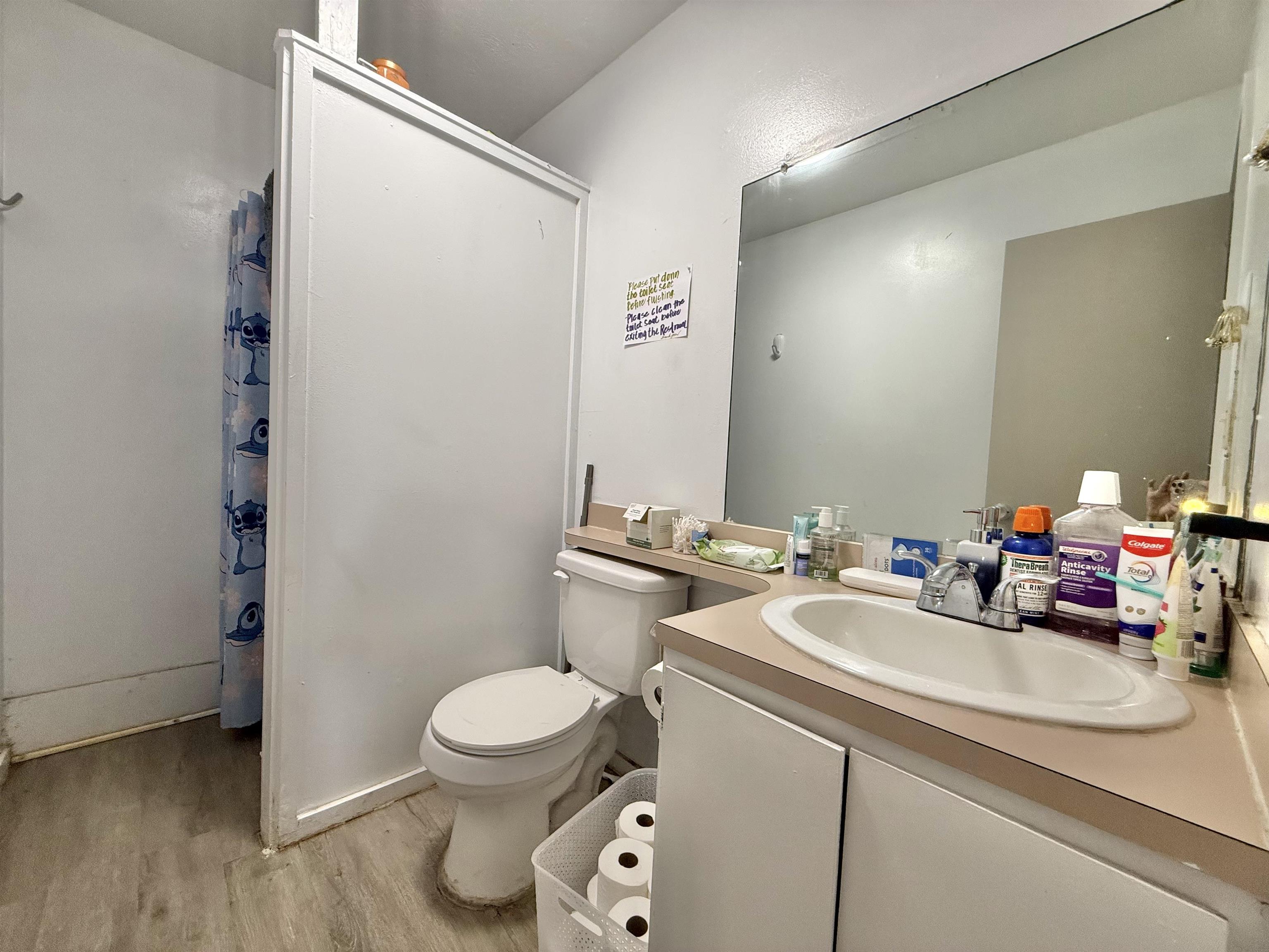 1630 Kauhikoa Road Haiku, HI 96708 - Photo 30 of 48 a bathroom with a sink toilet and a mirror