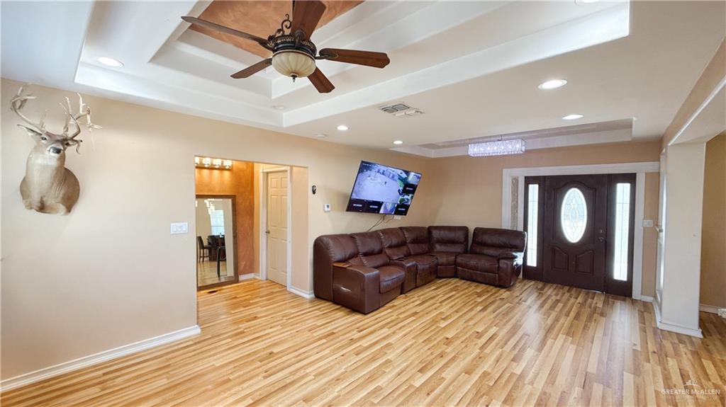1301 Minnesota Road Pharr, TX 78577 - Photo 19 of 28 a living room with furniture and a wooden floor