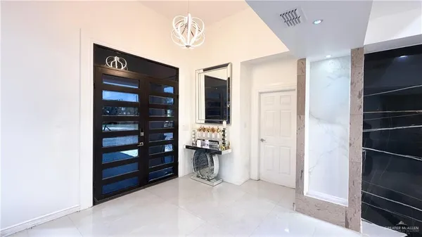 a view of an empty room and fire place