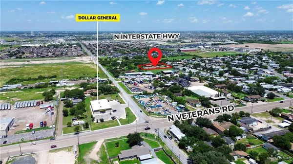 an aerial view of multiple houses with yard