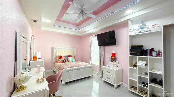 a room with furniture and a flat screen tv