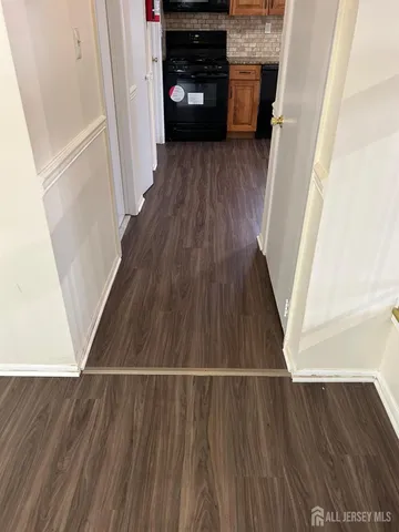 a view of a kitchen from a hallway
