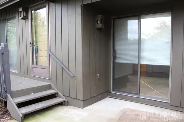 a view of a living room and a balcony