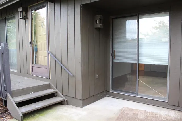 a view of a living room and a balcony