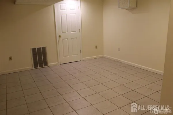 an empty room with wooden floor