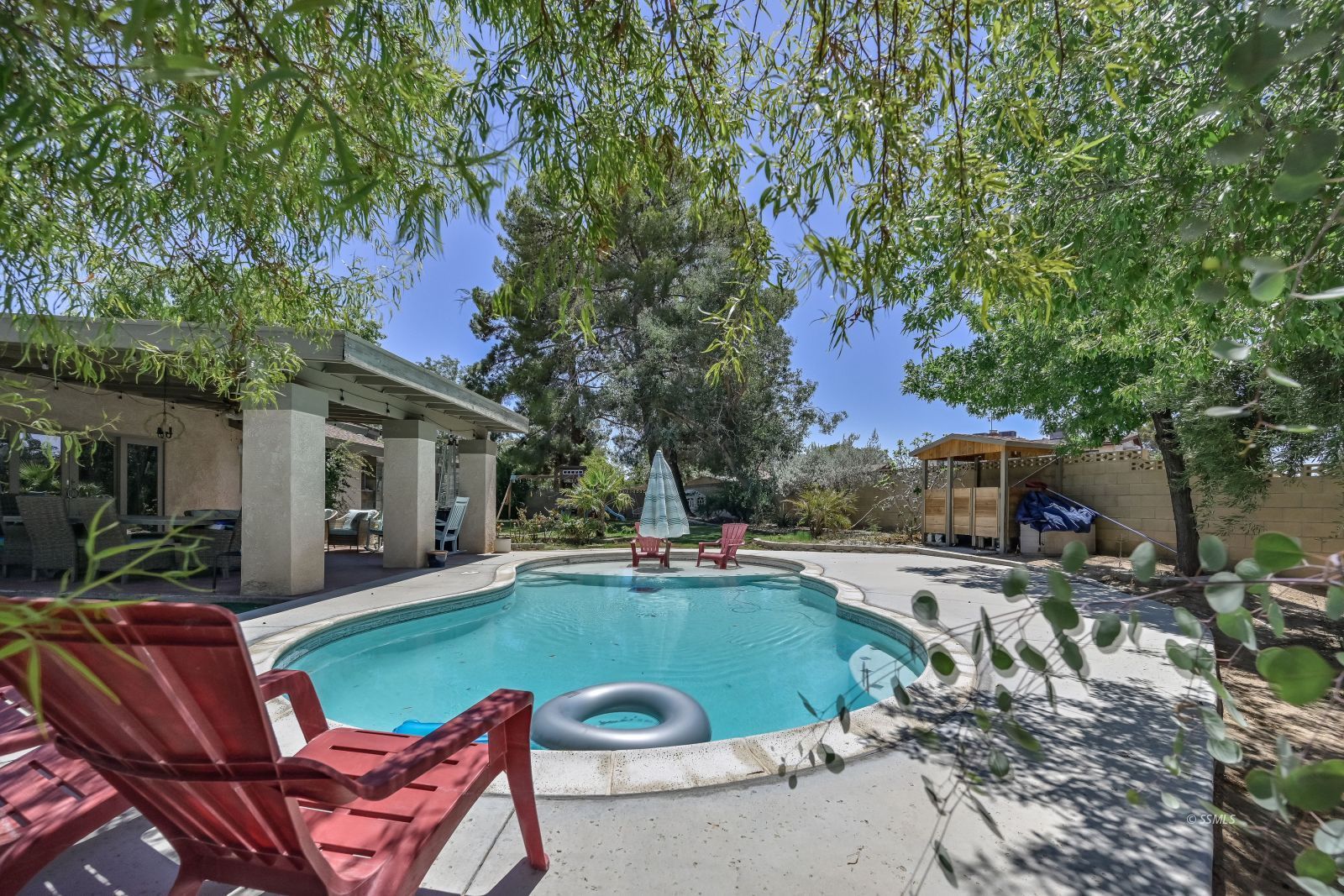 1025 Randall Street Ridgecrest, CA 93555 - Photo 44 of 50 a view of a house with backyard porch and sitting area