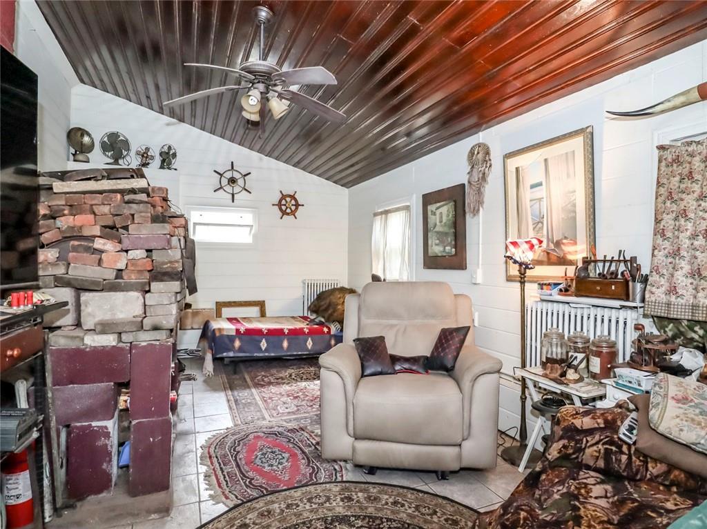 636 Holmdel Road Hazlet, NJ 07730 - Photo 11 of 47 a living room with furniture and a chandelier
