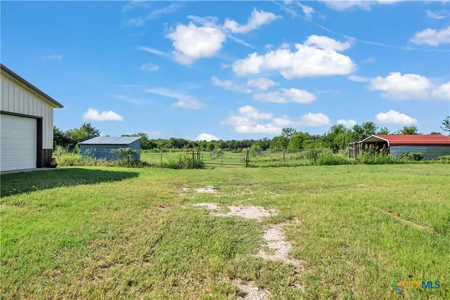 a view of a garden with an apartment