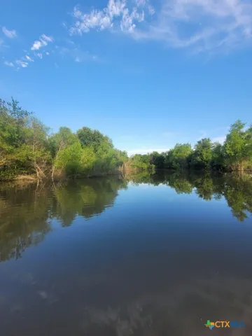 a view of a lake from a yard