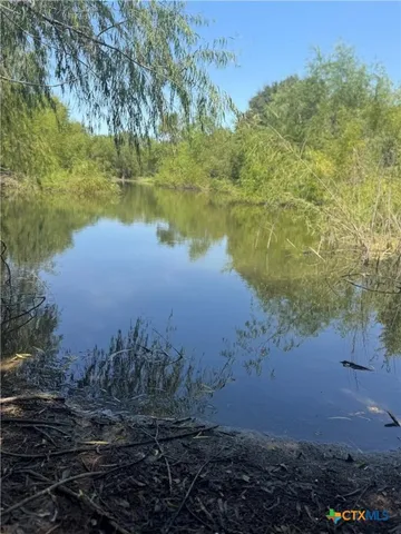 a view of lake with green space