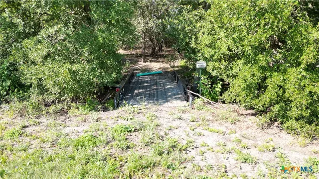 a backyard of a house with large trees