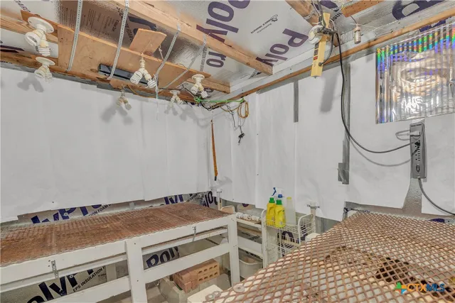a bathroom with a granite countertop sink a mirror and a shower