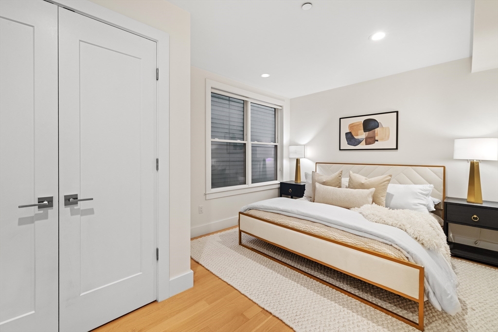 150 West Broadway, Unit 313A Boston, MA 02127 - Photo 8 of 10 a bedroom with a bed and a window