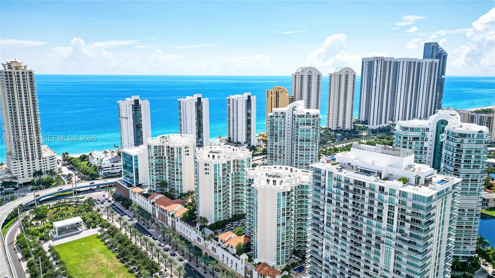 250 Sunny Isles Boulevard, Unit TH207 Sunny Isles Beach, FL 33160 - Photo 2 of 33 a city view with tall buildings and a yard