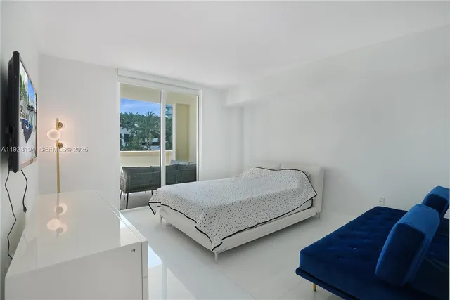 a bedroom with a bed and a couch