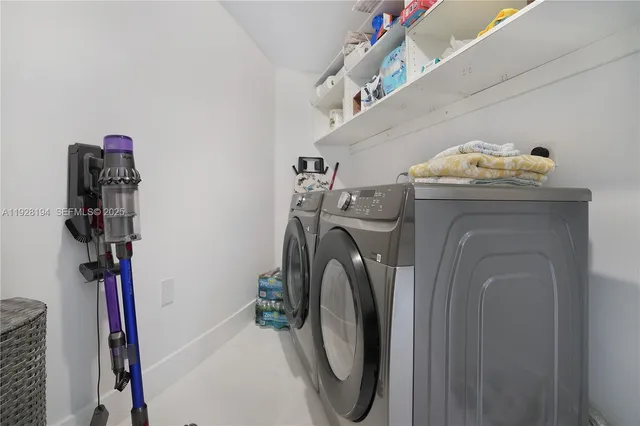 a utility room with dryer and washer