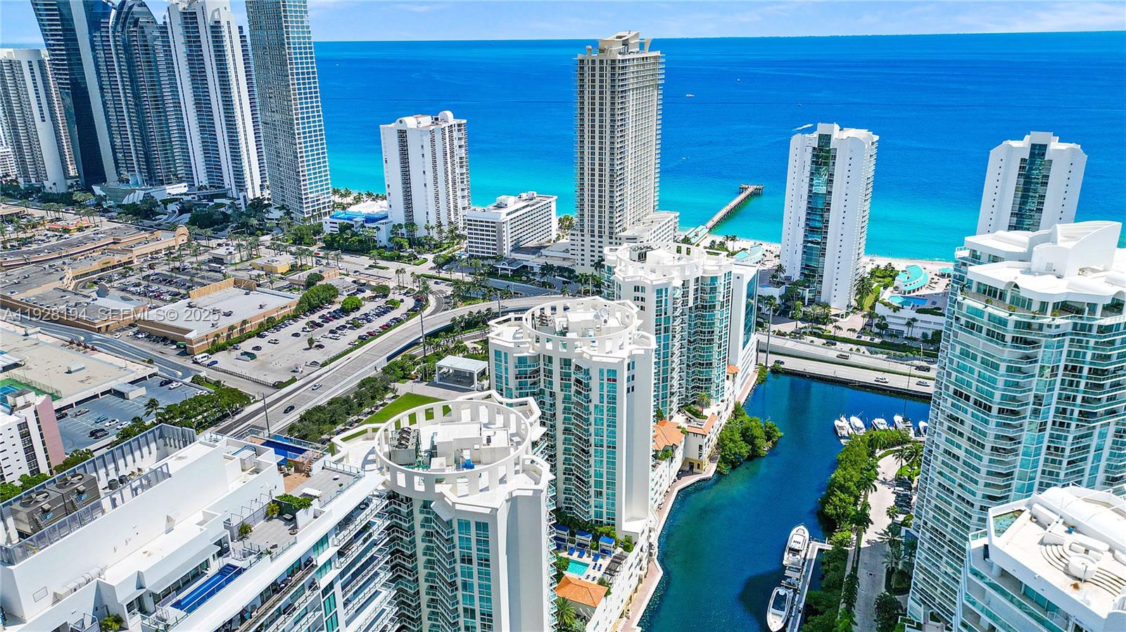 250 Sunny Isles Boulevard, Unit TH207 Sunny Isles Beach, FL 33160 - Photo 33 of 33 a balcony view with couple of chairs and potted plants